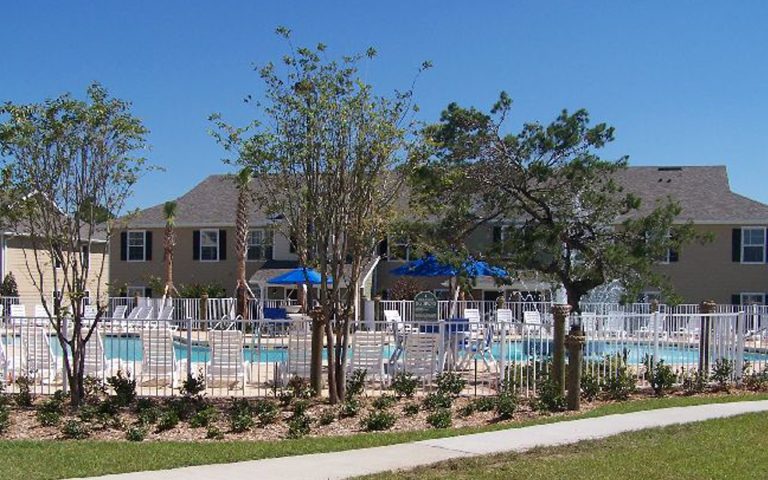 Bask in the sunshine at the pool area in your corporate housing rental in Panama City Beach.